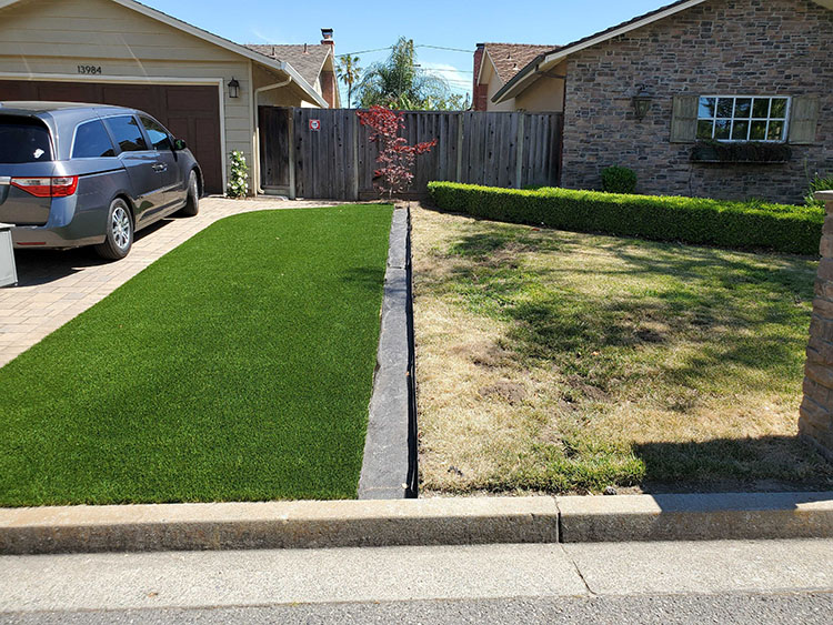 concrete driveway with artificial turf