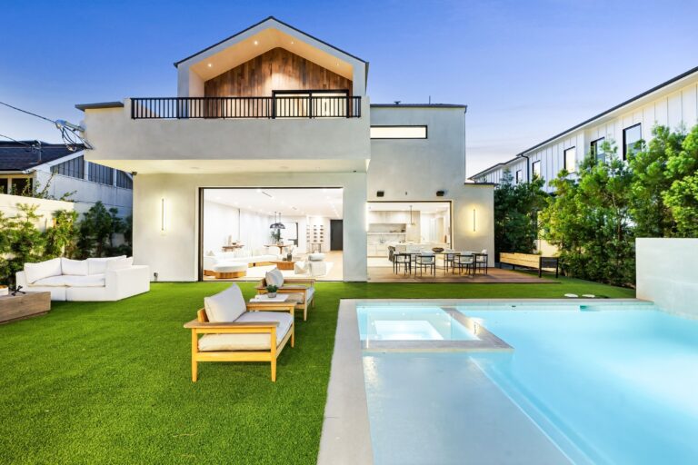 paradise with lush artificial grass around pool edges