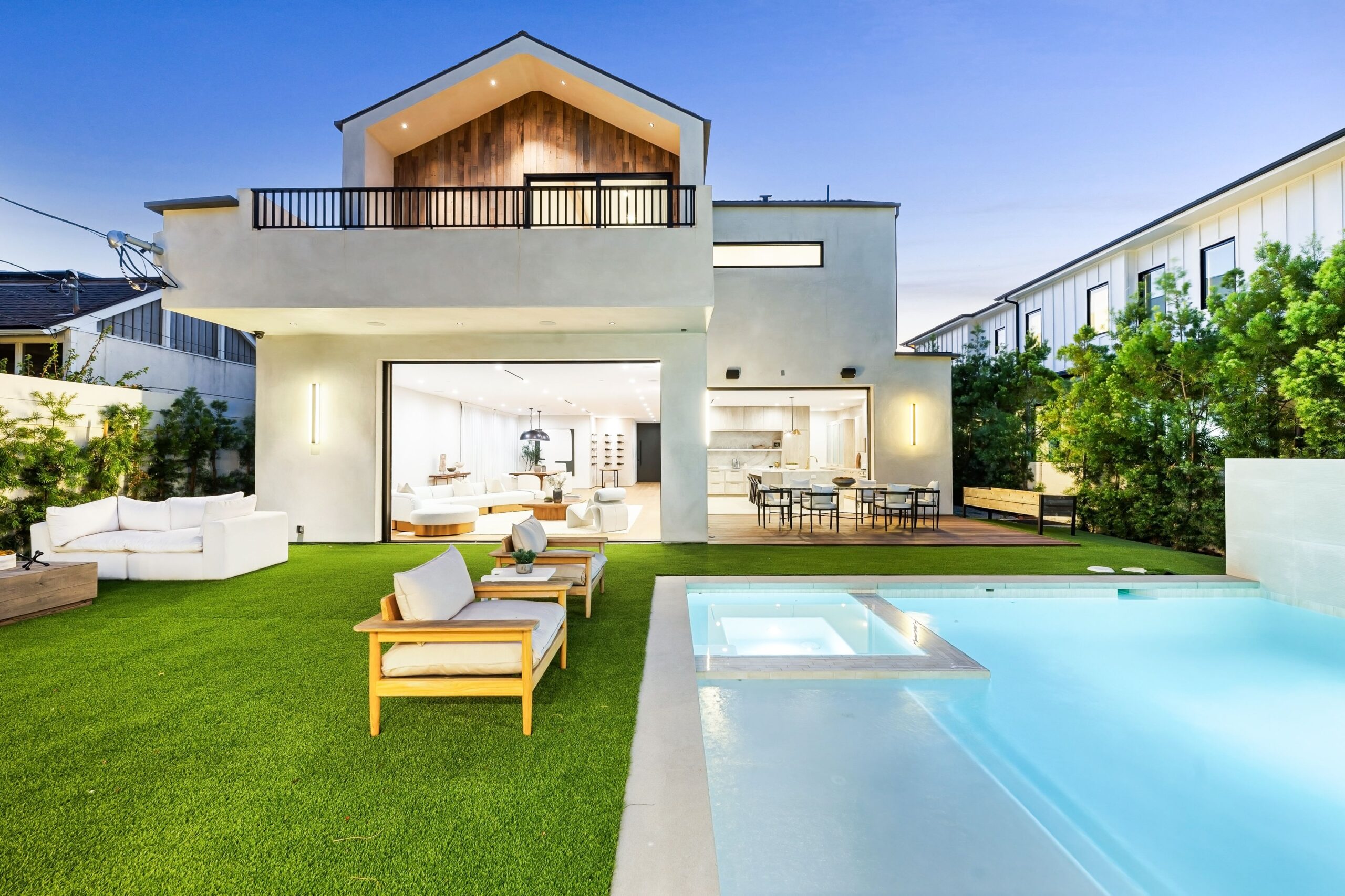 paradise with lush artificial grass around pool edges